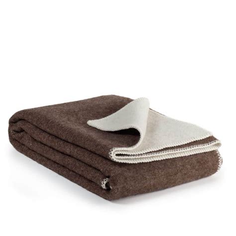 Tabel met de voor- en nadelen van katoenen, wollen en polyester/fleece dekens.