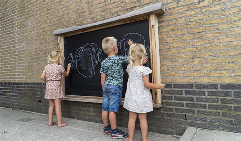 Een scorebord op een krijtbord met namen van kinderen en de titel 'Boer/Boerin'.
