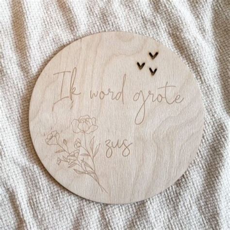 Houten bordje met de tekst 