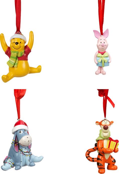 Informatiefoto van de Winnie de Poeh muziekmobiel met de personages Knorretje, Teigetje en Iejoor.