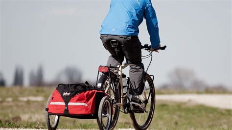 Infographic met de belangrijkste veiligheidskenmerken van een fietskar.