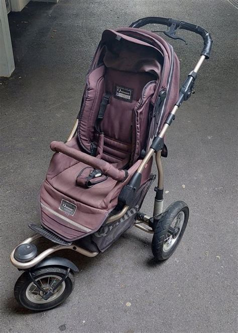 Historische foto van de eerste Quinny jogger kinderwagen.
