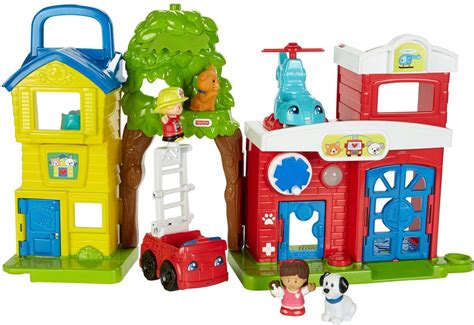 Afbeelding van een Fisher Price Little People stad speelset, met auto's en gebouwen.