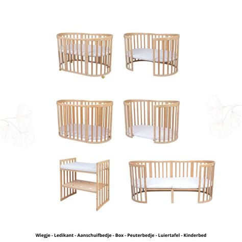 Vergelijking van een wieg en een ledikant, met focus op afmetingen en veiligheidskenmerken