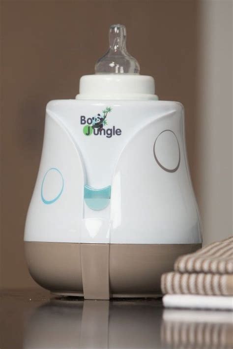Illustratie van de Bo Jungle B-Bottle flessenwarmer met de meegeleverde accessoires